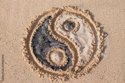 Ying Yang symbol drawn on the beach