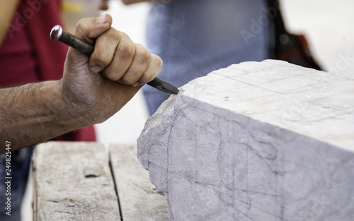 Carving stone, craftsman shaping stone