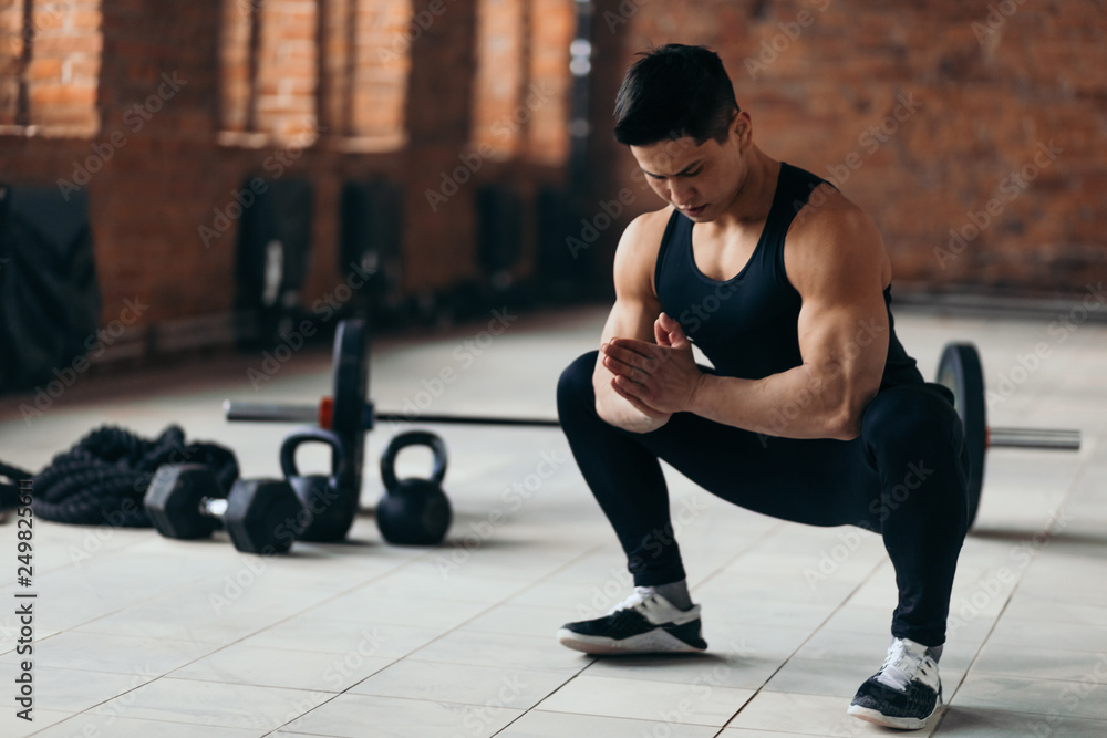 amatuar muscular sportsman doing squats during workout indoors, Healthy lifestyle.hobby , copy space, cross fit amatuar muscular sportsman doing squats during workout indoors, Healthy lifestyle.hobby , copy space, cross fit