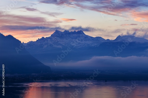 Beautiful view on the side of Geneva lake  with the peaks Dents du Midi of Swiss Alps in background  Montreux  Canton of Vaud  Switzerland Alps on Lake Geneva at Vevey  Switzerland