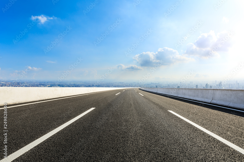 Fototapeta premium Empty asphalt road and modern city skyline with buildings in Shanghai,China