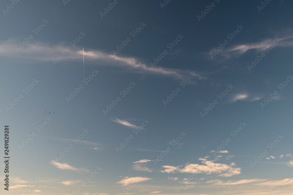 texture background wallpaper blue sky with clouds, an airplane und birds