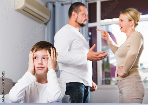 Sad boy during parents quarrel