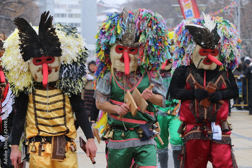 Pernik, Bulgaria - January 27, 2019 - Masquerade festival Surva in Pernik, Bulgaria. People with mask called Kukeri dance and perform to scare the evil spirits.