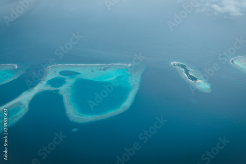 Maldives from the Sky with the blue sea and white sand and beach in the indian ocean
