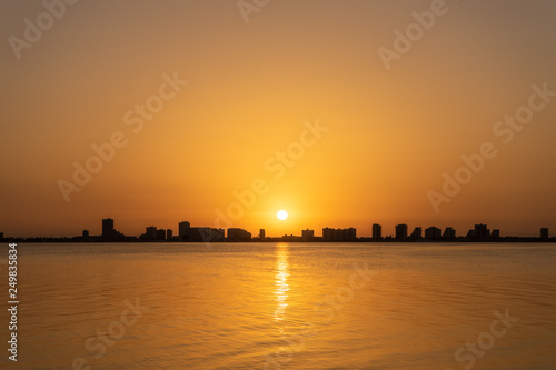 Sunrise and city silhouette