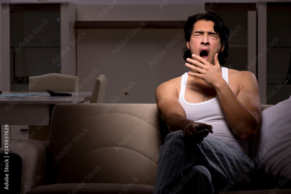 Fototapeta premium Young man suffering at home night time 
