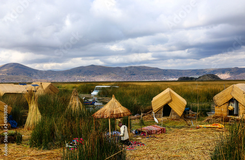 Traditional reed houses on the island Uros, Lake Titicaca, Peru photo