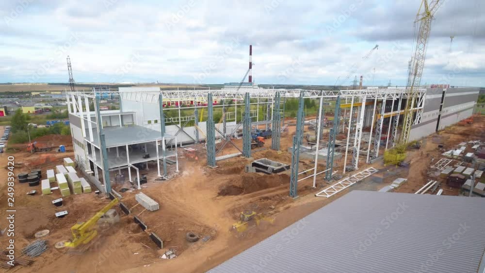timelapse storage building with cranes from spring to winter