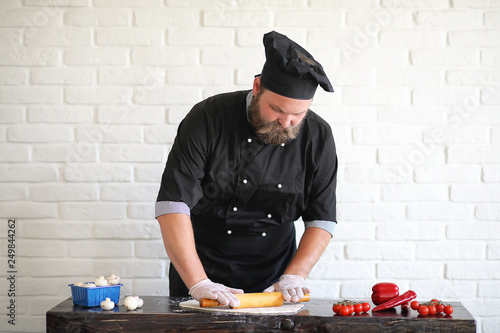 Bearded chef chef prepares meals