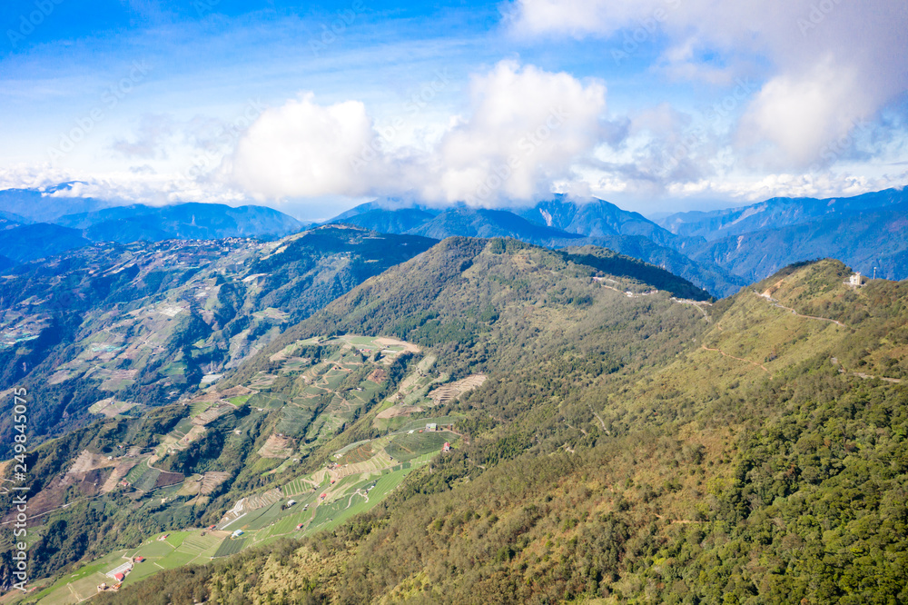 Flying drone towards beautiful amazing famous Mt. Hehuan in Taiwan over above the hilltop, aerial view shot. Flying drone towards beautiful amazing famous Mt. Hehuan in Taiwan over above the hilltop, aerial view shot.
