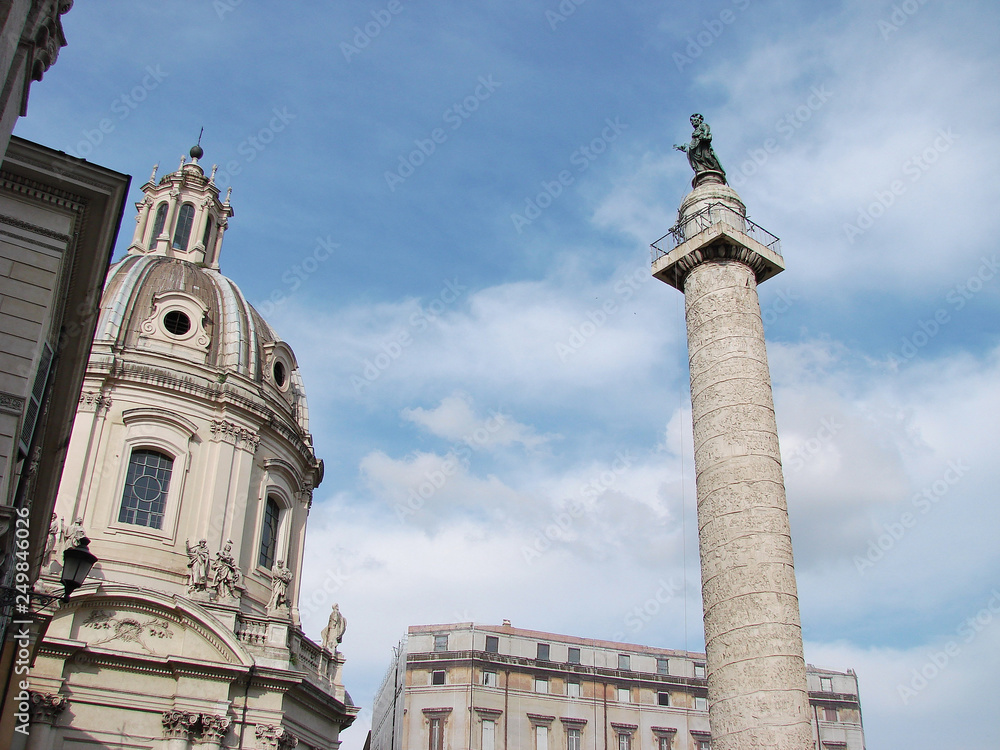 Obraz premium Forum of Cesari in Rome with Trajan's Column and church in background