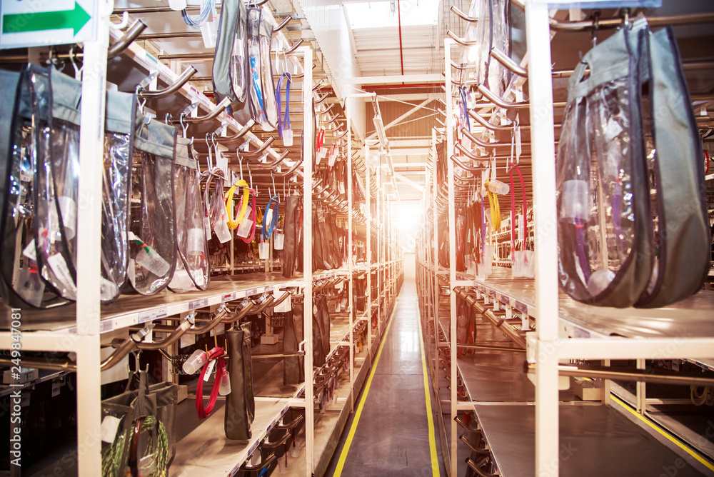 Industrial landscape with wire racks in a modern plant for the production of electric wiring for automobiles. Logistics