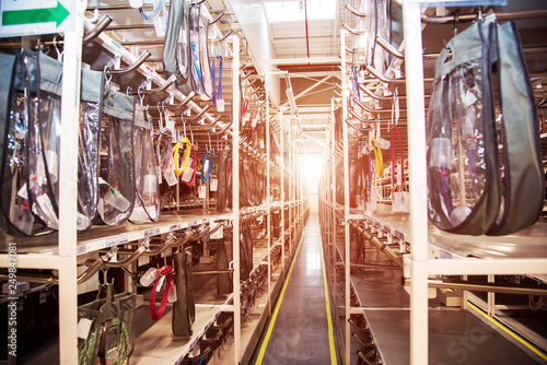 Obraz na płótnie Industrial landscape with wire racks in a modern plant for the production of electric wiring for automobiles. Logistics w salonie
