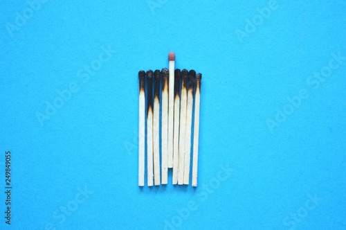 Business concept. Matches on blue background.