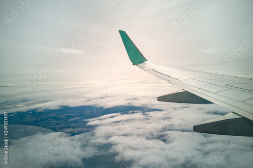 wing of airplane and sky landscape. the earth and the blue sea background