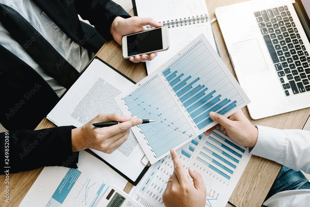 Top view of business people discussing with colleagues with entrepreneurs are planning finance in office room. Top view of business people discussing with colleagues with entrepreneurs are planning finance in office room.
