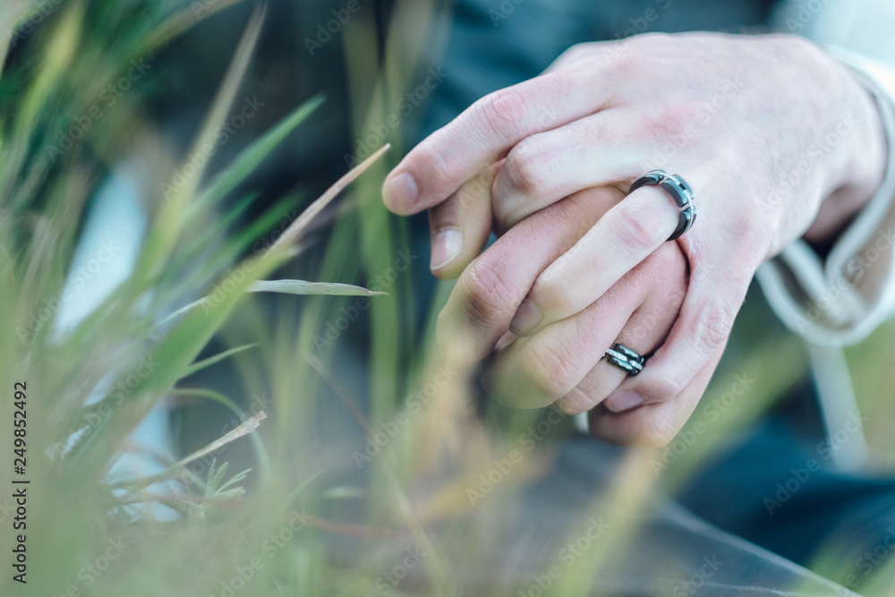 Wedding rings worn by two men at a wedding Wedding rings worn by two men at a wedding