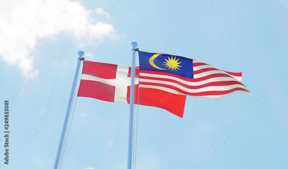 Malaysia and Denmark, two flags waving against blue sky. 3d image Malaysia and Denmark, two flags waving against blue sky. 3d image