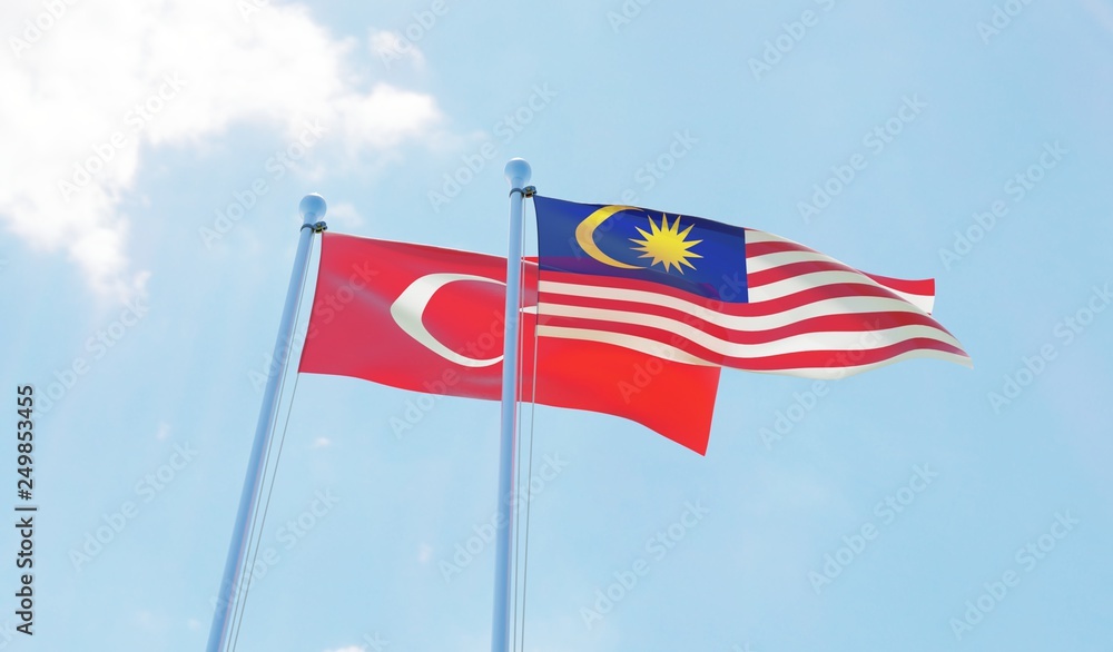 Malaysia and Turkey, two flags waving against blue sky. 3d image