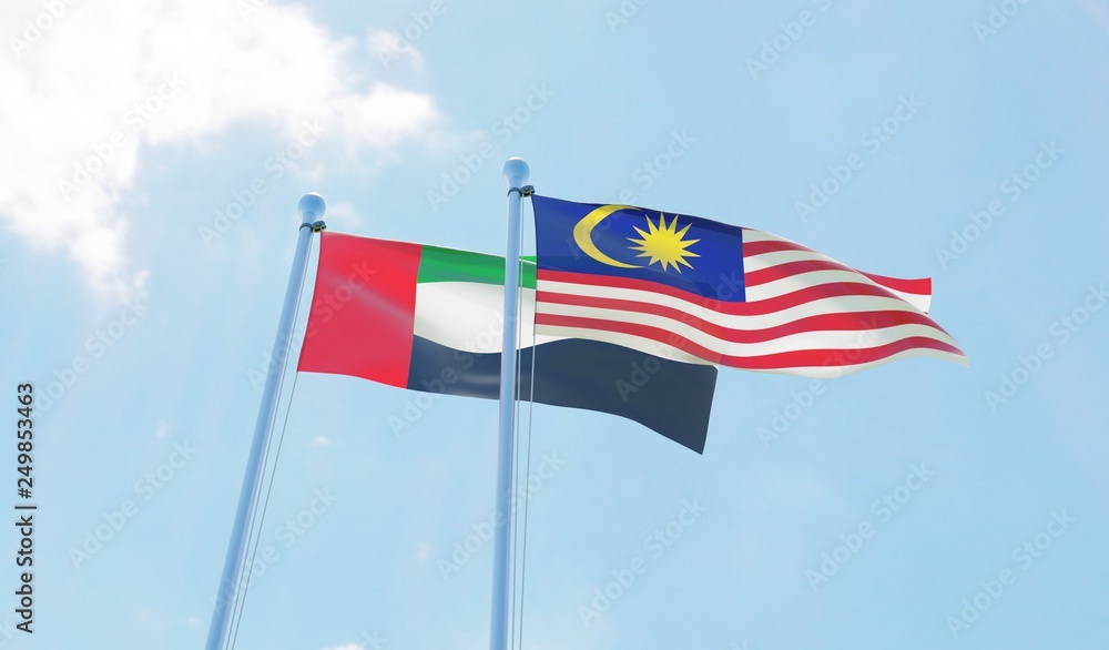 Malaysia and UAE, two flags waving against blue sky. 3d image Malaysia and UAE, two flags waving against blue sky. 3d image