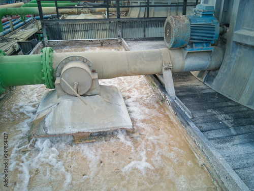 Cooling Tower on Operation . Used in factories .device that rejects waste heat to the atmosphere. photo