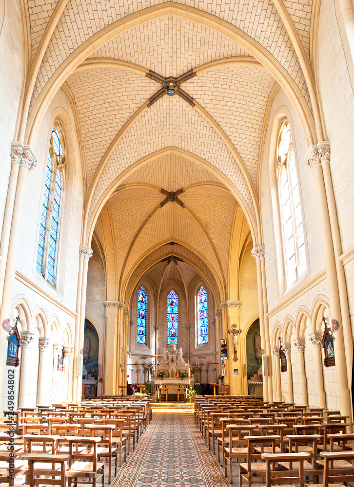 Fototapeta premium Architectural details of a small church in a town of Neuvy-en-Mauges