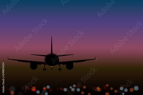  airplane on the background lights of the night city bokeh effect top view at sunset