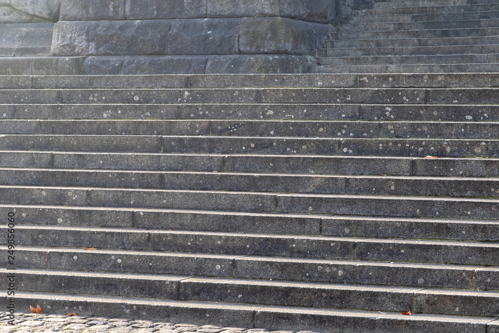 Stony staircase with several steps outside