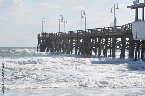 Waves crashing on pier © Lorie Smith