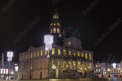 Maastricht city hall during evening with illuminated windows
