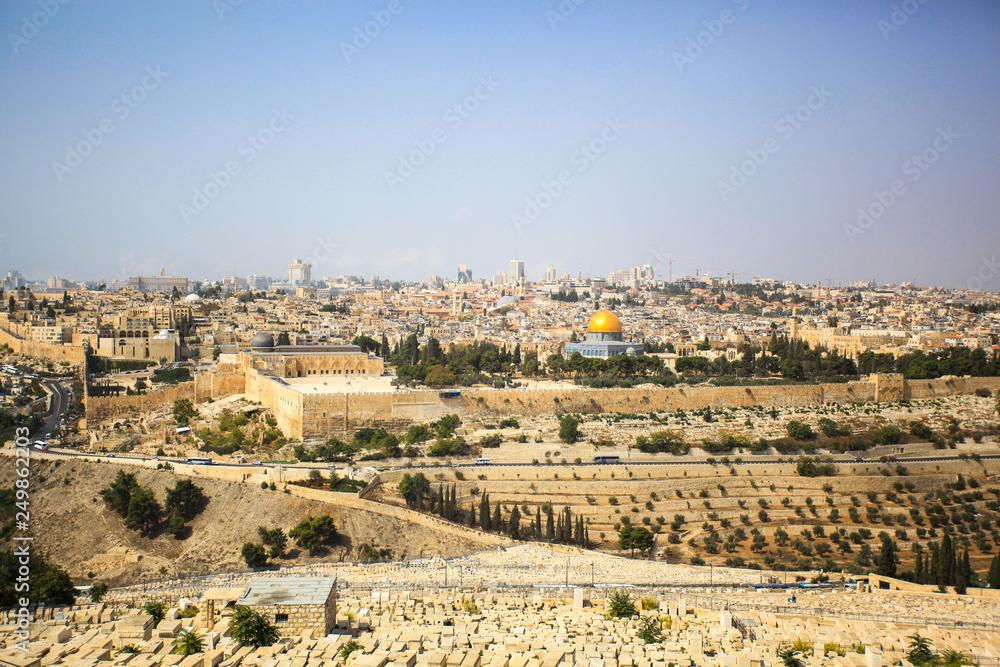 View of the old city of Jerusalem. Ancient buildings, old cemetery and mosque. Intersection of cultures and religions