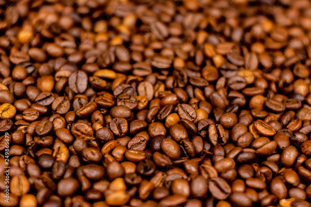 Coffee beans bright saturated texture. Roasted coffee beans background. Coffee beans bright saturated texture. Roasted coffee beans background.