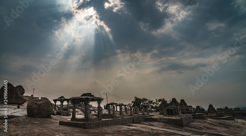 view of temple with dramatic mystic sky in hampi india karnakata