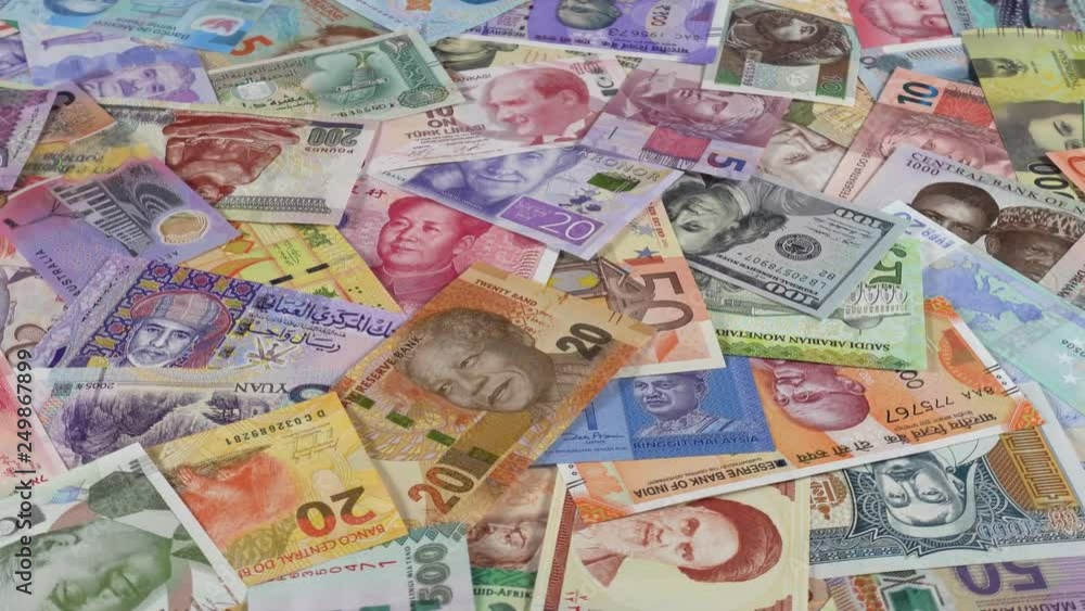 World currencies notes heap slow rotating. World money. Low angle. 4K stock video footage World currencies notes heap slow rotating. World money. Low angle. 4K stock video footage