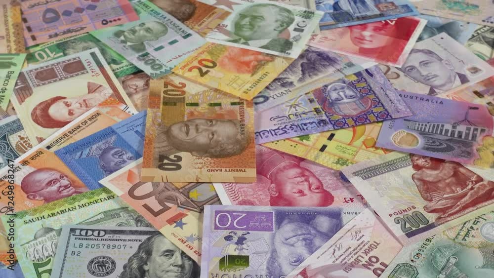 Many world currencies banknotes slow rotating. World money, economy. Low angle. 4K stock video footage Many world currencies banknotes slow rotating. World money, economy. Low angle. 4K stock video footage