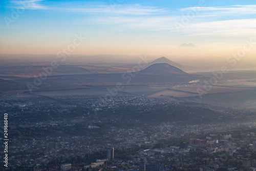Beautiful city with mountain in the haze photo