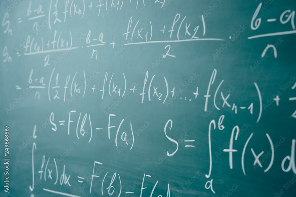 Math class. Algebra. The formulas are written on the school board Math class. Algebra. The formulas are written on the school board
