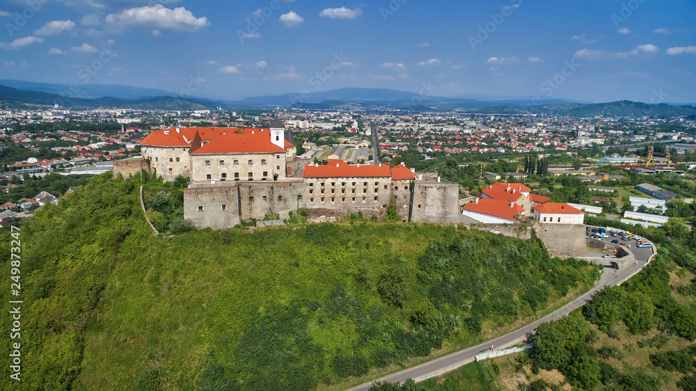Aerial view on the ancient castle of Palanok and the foothills of Carpathians Mountains, in Mukachevo.