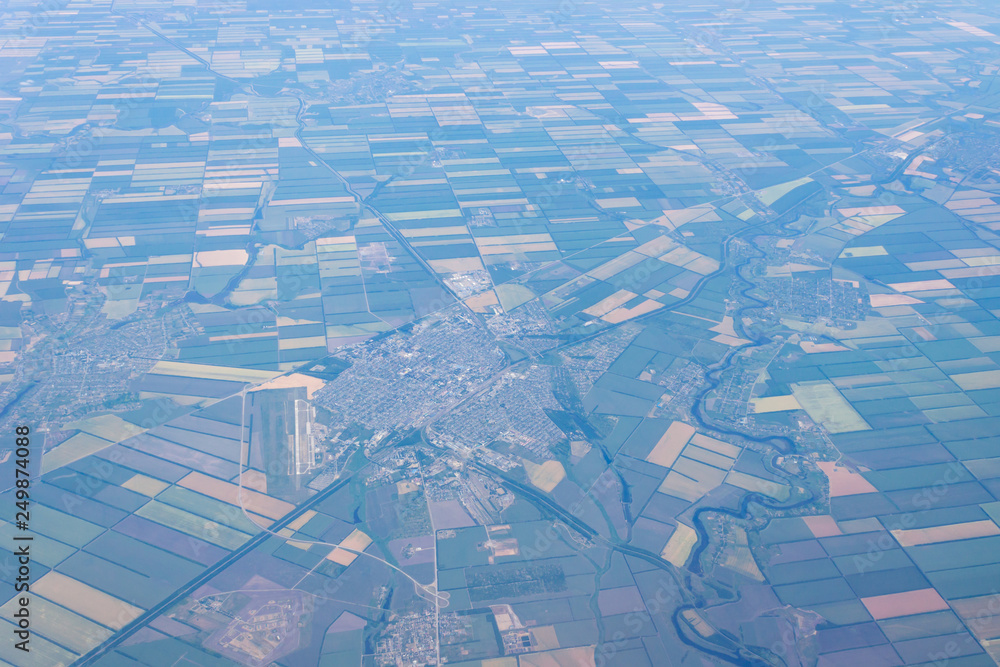 Fototapeta premium View from the plane to the city of Tikhoretsk and the village of Fastovetskaya