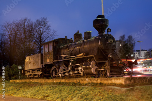 KOUVOLA, FINLAND - NOVEMBER 8, 2018: Old steam locomotive as an exhibit at the Kouvola railway station in Finland at night.