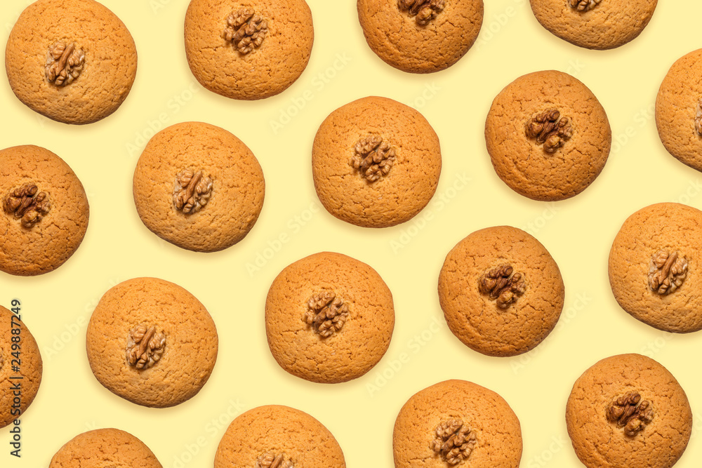 Delicious pattern of honey cookies on a yellow background. View from above Delicious pattern of honey cookies on a yellow background. View from above