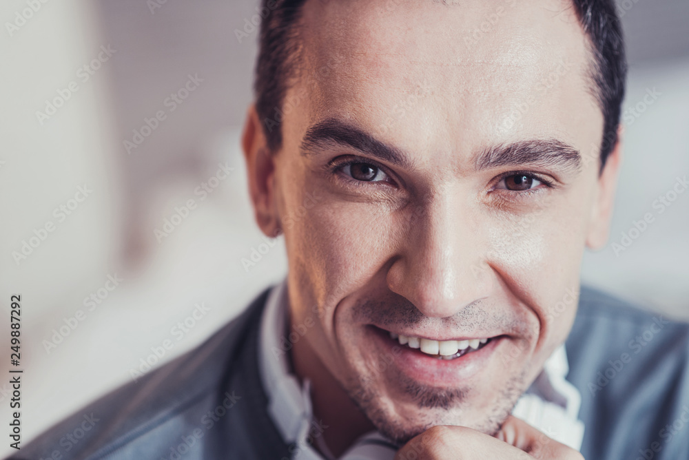 Obraz premium Portrait of a delighted cheerful man