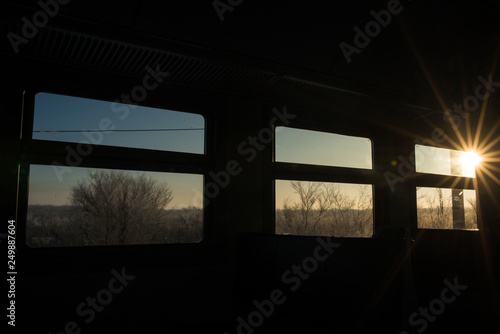 Windows in the train reminiscent of film, each window-a separate frame with its own story