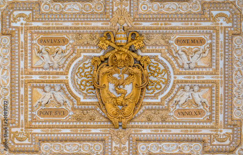 Paulus V coat of arms in the ceiling of the portico in Saint Peter Basilica in Rome, Italy.