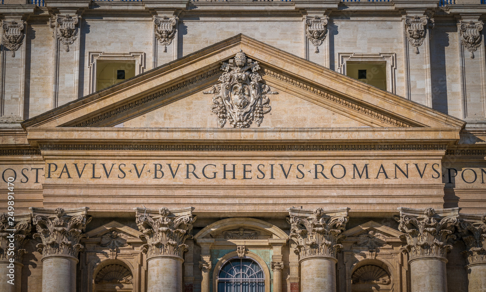 Facade with Paulus V coat of arms, Saint Peter Basilica in Rome, Italy.