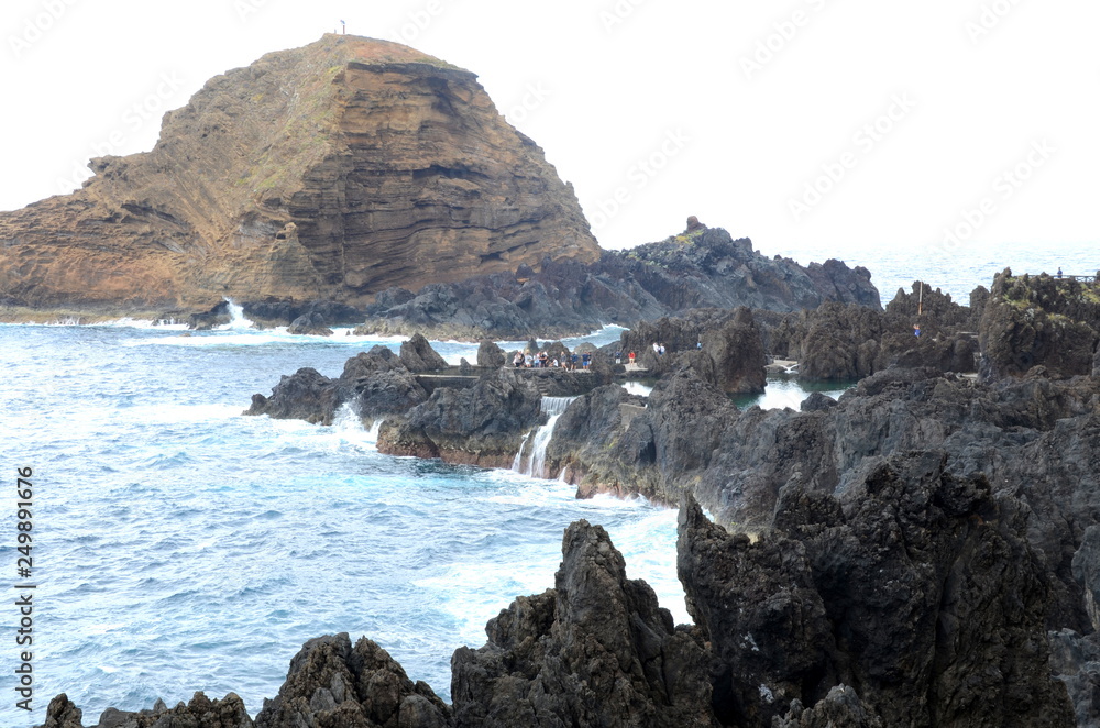 Natural swimming pools formed by volcanic rock at Porto Moniz, Madeira