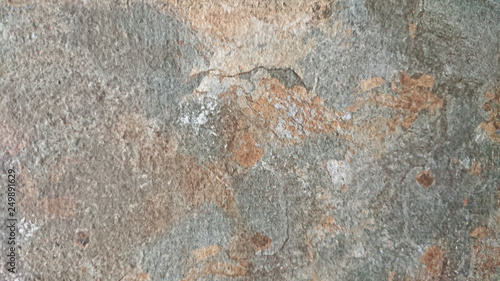 The abstract background of old gray wall with natural cement texture in selective focus