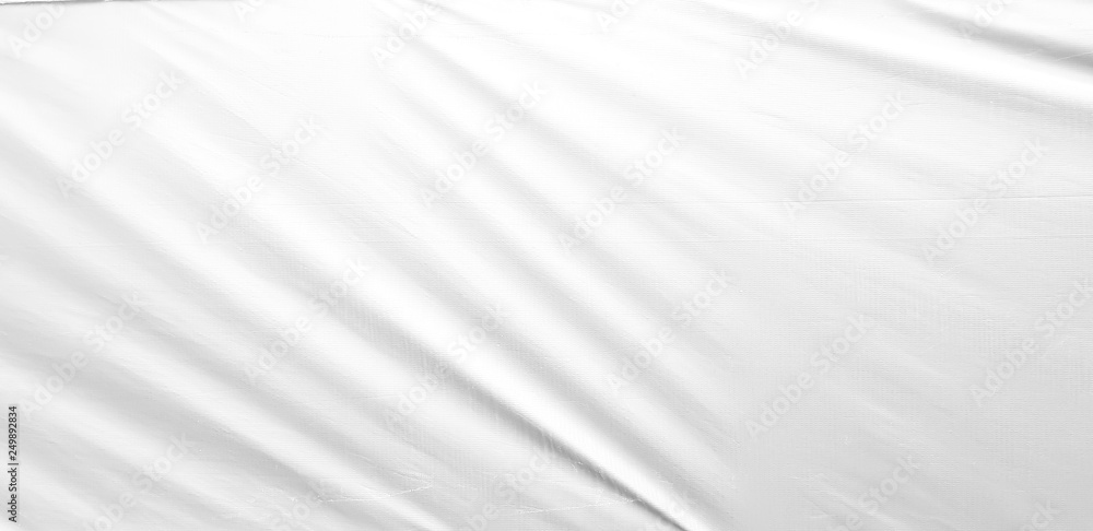 Fototapeta premium White silky soft cloth background - satin fabric with folds