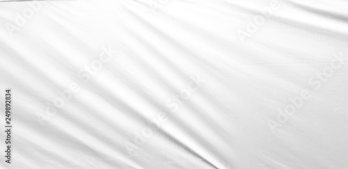 White silky soft cloth background - satin fabric with folds